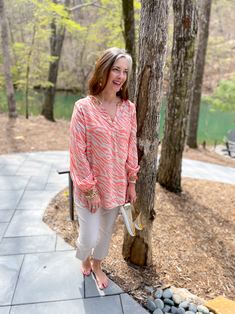 woman leaning against tree